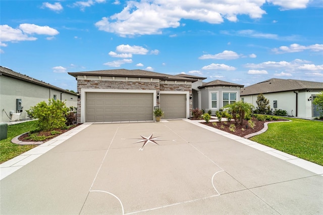 8606 SW 61st Loop, Ocala, FL 34481 - prairie-style home featuring concrete driveway, an attached garage, stone siding, and a front yard