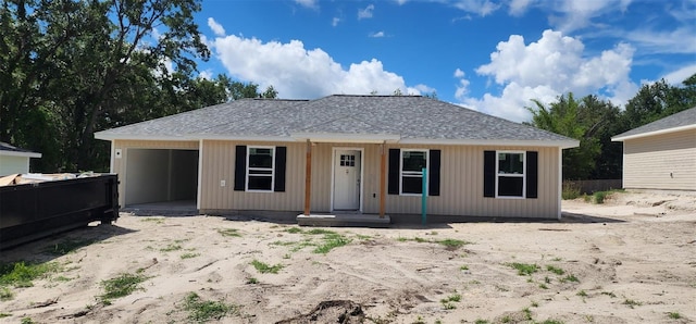 24128 SW S Lakes Ct, Dunnellon, FL 34431 - view of front of home with an attached garage, fence, and roof with shingles