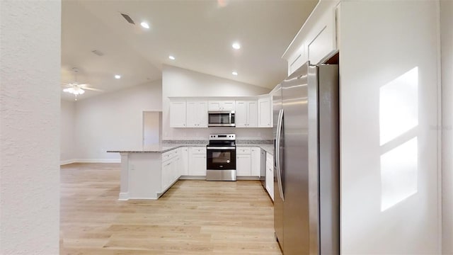 24128 SW S Lakes Ct, Dunnellon, FL 34431 - kitchen featuring stainless steel appliances, a peninsula, white cabinetry, light wood-style flooring, and a ceiling fan
