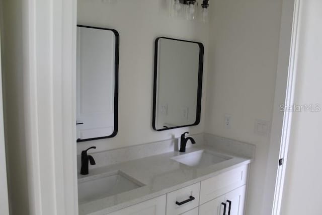 full bathroom featuring double vanity