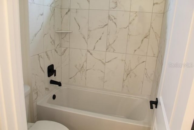 full bath featuring toilet and  shower combination