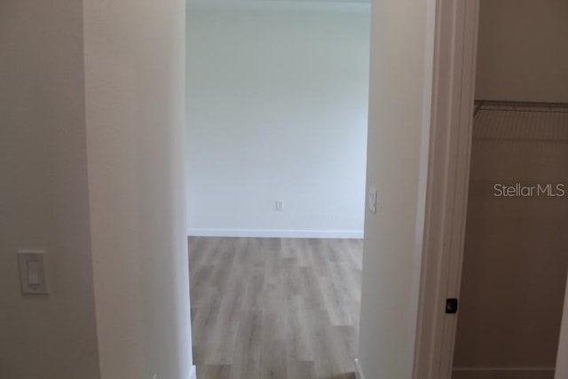 hallway with wood finished floors
