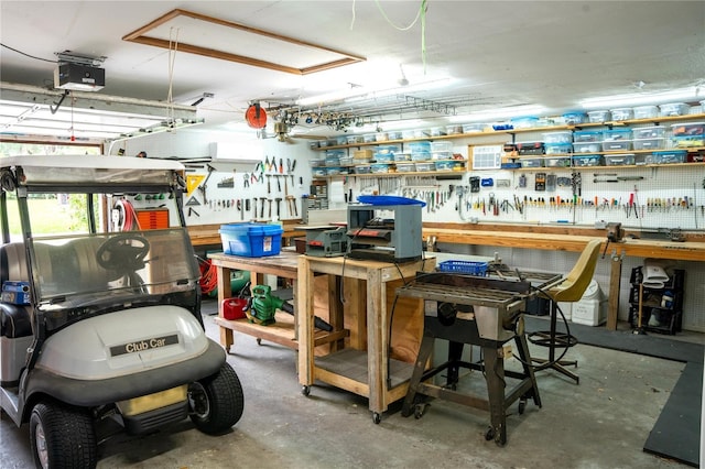7023 W Riverbend Rd, Dunnellon, FL 34433 - garage featuring a workshop area and a garage door opener