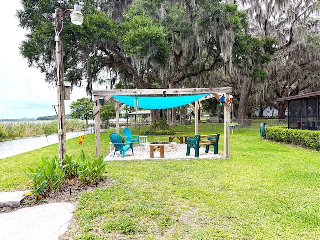 7023 W Riverbend Rd, Dunnellon, FL 34433 - view of property's community with a fire pit and a patio