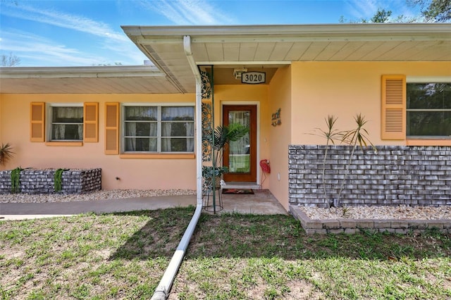 3020 E Scofield St, Inverness, FL 34453 - entrance to property with stucco siding