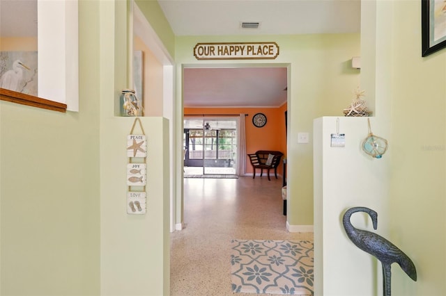 3020 E Scofield St, Inverness, FL 34453 - hallway featuring speckle patterned floor and baseboards