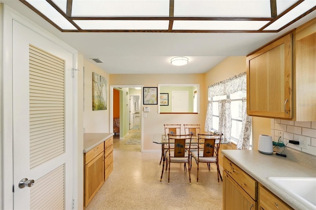 3020 E Scofield St, Inverness, FL 34453 - dining space featuring baseboards and dark speckled floor