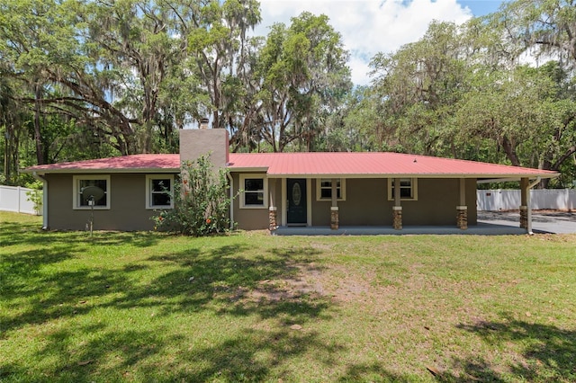 4010 SW 7th Avenue Rd, Ocala, FL 34471 - rear view of property with a chimney, metal roof, stucco siding, and a patio