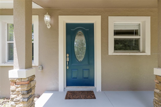 4010 SW 7th Avenue Rd, Ocala, FL 34471 - property entrance featuring stucco siding and covered porch