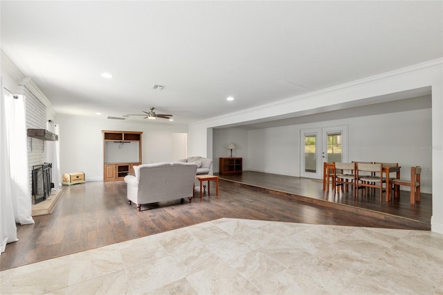 4010 SW 7th Avenue Rd, Ocala, FL 34471 - living area with a fireplace, a ceiling fan, recessed lighting, ornamental molding, and wood finished floors