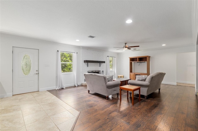 4010 SW 7th Avenue Rd, Ocala, FL 34471 - living room with a ceiling fan, a brick fireplace, recessed lighting, baseboards, and wood-type flooring