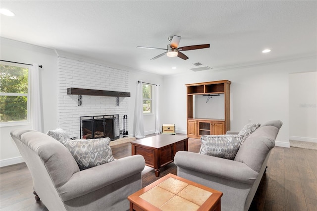4010 SW 7th Avenue Rd, Ocala, FL 34471 - living room featuring a ceiling fan, wood-type flooring, baseboards, a brick fireplace, and recessed lighting