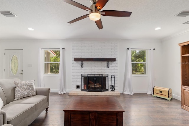 4010 SW 7th Avenue Rd, Ocala, FL 34471 - living area featuring ceiling fan, dark wood-type flooring, a fireplace, baseboards, and ornamental molding