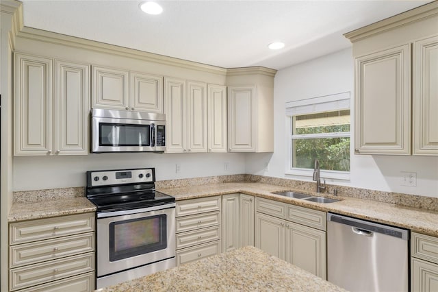 4010 SW 7th Avenue Rd, Ocala, FL 34471 - kitchen featuring appliances with stainless steel finishes, a sink, cream cabinets, and recessed lighting