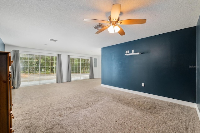 4010 SW 7th Avenue Rd, Ocala, FL 34471 - spare room with ceiling fan, carpet flooring, a textured ceiling, and baseboards