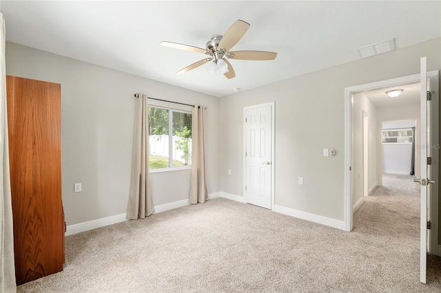 4010 SW 7th Avenue Rd, Ocala, FL 34471 - unfurnished bedroom with light carpet, baseboards, and ceiling fan