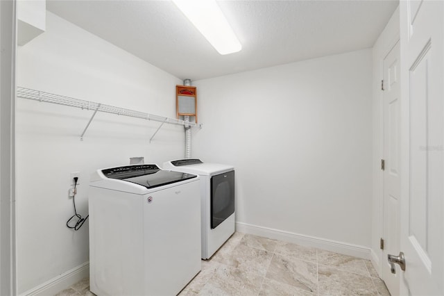 4010 SW 7th Avenue Rd, Ocala, FL 34471 - laundry room with washing machine and dryer and baseboards