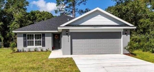 single story home with a garage, concrete driveway, a front lawn, and stucco siding