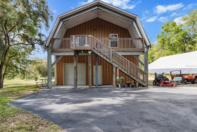 7059 N Lecanto Hwy, Hernando, FL 34442 - view of front of house featuring stairs and board and batten siding