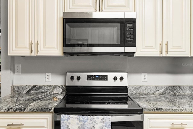 7059 N Lecanto Hwy, Hernando, FL 34442 - kitchen with stainless steel appliances and stone counters