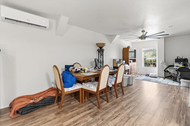7059 N Lecanto Hwy, Hernando, FL 34442 - dining area with a wall mounted AC, light wood-type flooring, a ceiling fan, an office area, and a textured ceiling