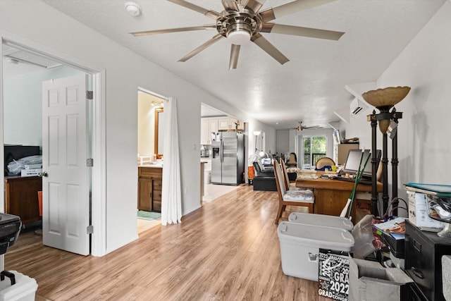 7059 N Lecanto Hwy, Hernando, FL 34442 - living room featuring ceiling fan, light wood-style flooring, and an AC wall unit