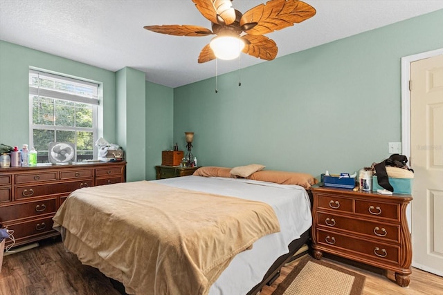 7059 N Lecanto Hwy, Hernando, FL 34442 - bedroom featuring wood finished floors and a ceiling fan
