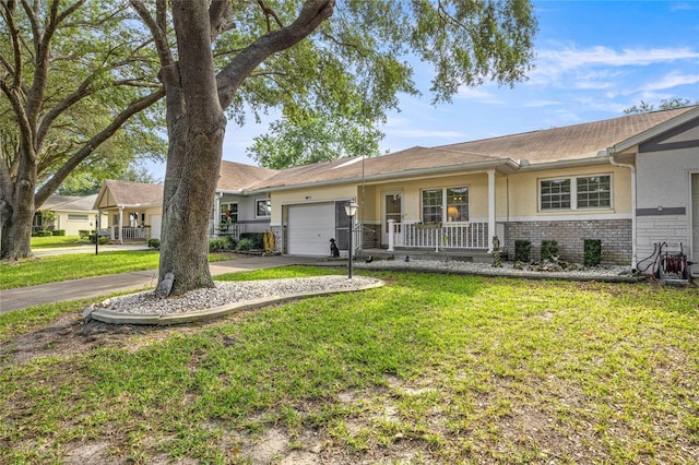9667 SW 94th Ct Unit C, Ocala, FL 34481 - single story home featuring stucco siding, a porch, a front lawn, a garage, and concrete driveway