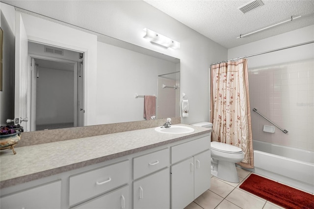 9667 SW 94th Ct Unit C, Ocala, FL 34481 - bathroom featuring toilet, vanity, a textured ceiling, tile patterned flooring, and shower / bath combination with curtain
