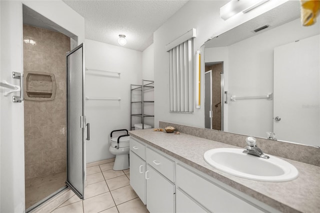 9667 SW 94th Ct Unit C, Ocala, FL 34481 - bathroom with a stall shower, tile patterned floors, vanity, toilet, and a textured ceiling