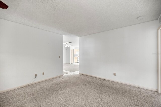 9667 SW 94th Ct Unit C, Ocala, FL 34481 - spare room with ceiling fan, carpet flooring, a textured ceiling, a smoke detector, and baseboards