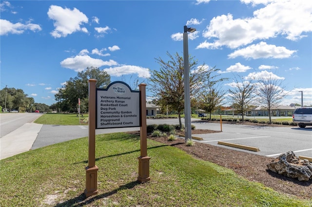 9667 SW 94th Ct Unit C, Ocala, FL 34481 - community / neighborhood sign with a yard and uncovered parking