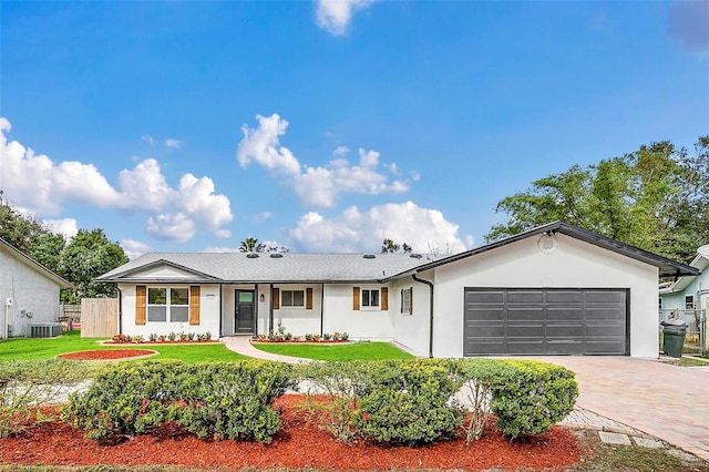 8622 Baylor Cir, Orlando, FL 32817 - single story home featuring central AC, a garage, decorative driveway, and stucco siding