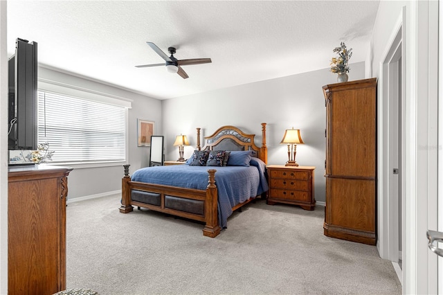 7641 SW 63rd Lane Rd, Ocala, FL 34474 - bedroom featuring light carpet, baseboards, ceiling fan, and a textured ceiling