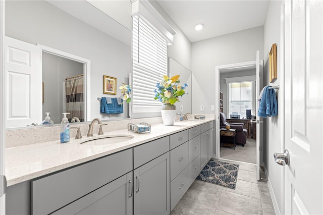 7641 SW 63rd Lane Rd, Ocala, FL 34474 - bathroom featuring double vanity and a shower with curtain