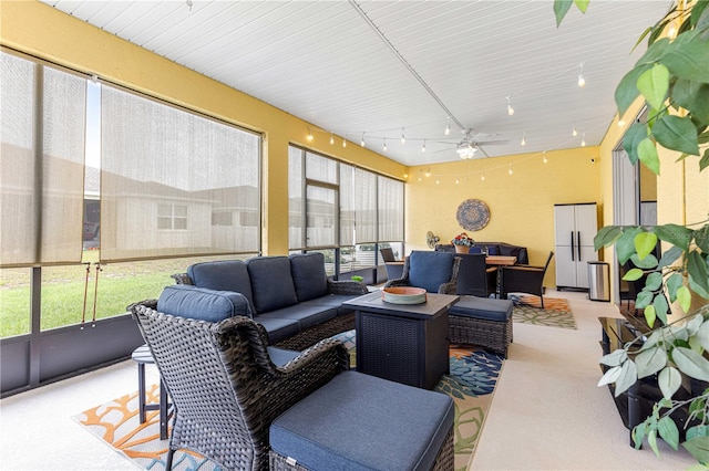 7641 SW 63rd Lane Rd, Ocala, FL 34474 - sunroom / solarium featuring track lighting, an outdoor hangout area, a ceiling fan, and outdoor dining space