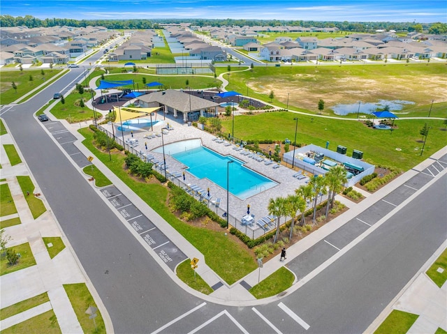 7641 SW 63rd Lane Rd, Ocala, FL 34474 - aerial perspective of suburban area featuring a pool and a large body of water