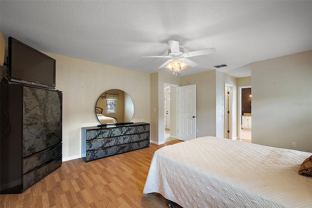 bedroom featuring wood finished floors, baseboards, and ceiling fan