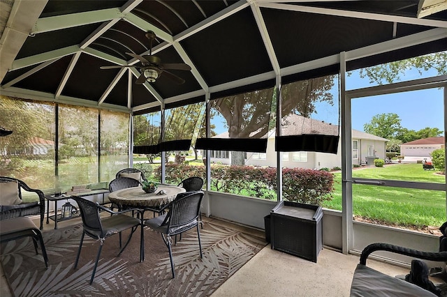 sunroom featuring a ceiling fan