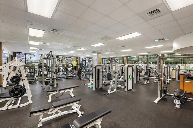 workout area featuring a paneled ceiling