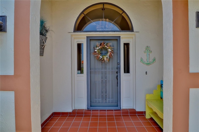 entrance to property with stucco siding