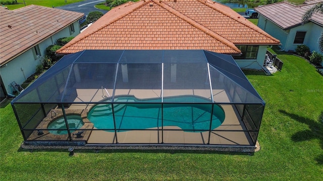 aerial view of property and surrounding area featuring a pool