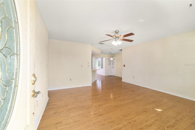 8375 SW 109th Lane Rd, Ocala, FL 34481 - empty room featuring ceiling fan, light wood finished floors, and baseboards