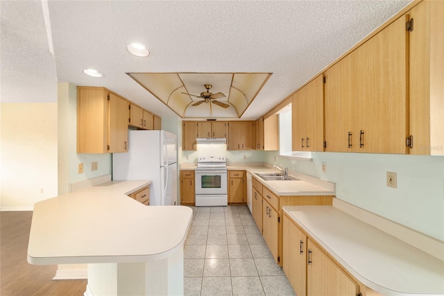 8375 SW 109th Lane Rd, Ocala, FL 34481 - kitchen with white appliances, a peninsula, a sink, light countertops, and ceiling fan