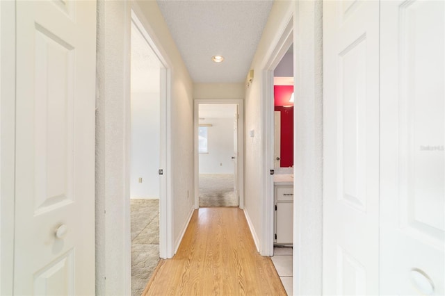 8375 SW 109th Lane Rd, Ocala, FL 34481 - hall featuring light wood-style flooring, baseboards, and recessed lighting