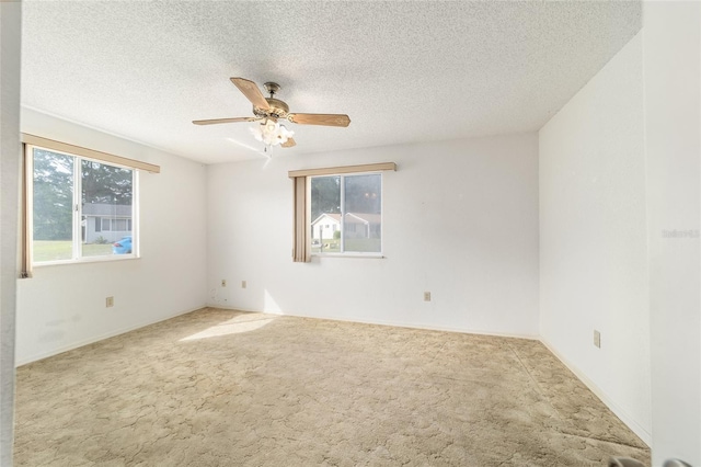 8375 SW 109th Lane Rd, Ocala, FL 34481 - empty room with plenty of natural light, carpet, a ceiling fan, and a textured ceiling