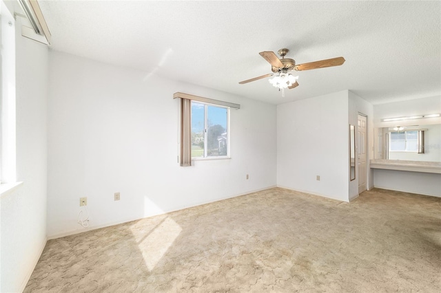 8375 SW 109th Lane Rd, Ocala, FL 34481 - unfurnished room featuring plenty of natural light, ceiling fan, and carpet floors