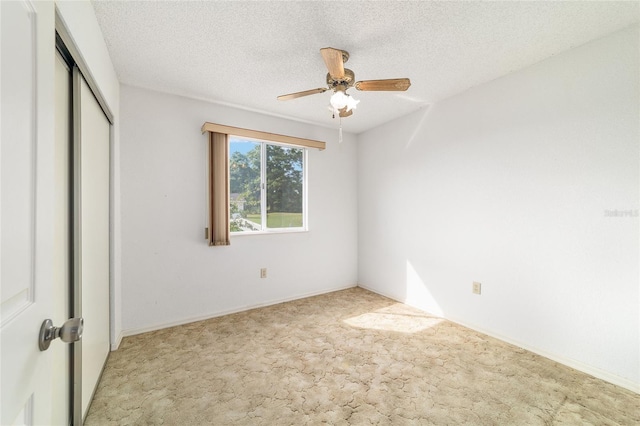 8375 SW 109th Lane Rd, Ocala, FL 34481 - unfurnished bedroom featuring carpet, a closet, ceiling fan, and a textured ceiling