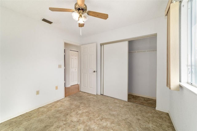 8375 SW 109th Lane Rd, Ocala, FL 34481 - unfurnished bedroom featuring carpet flooring, a closet, a ceiling fan, and baseboards