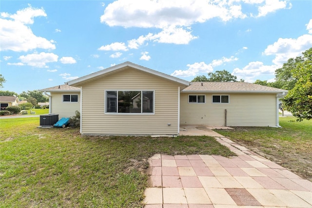 8375 SW 109th Lane Rd, Ocala, FL 34481 - rear view of house featuring a yard, central AC unit, and a patio